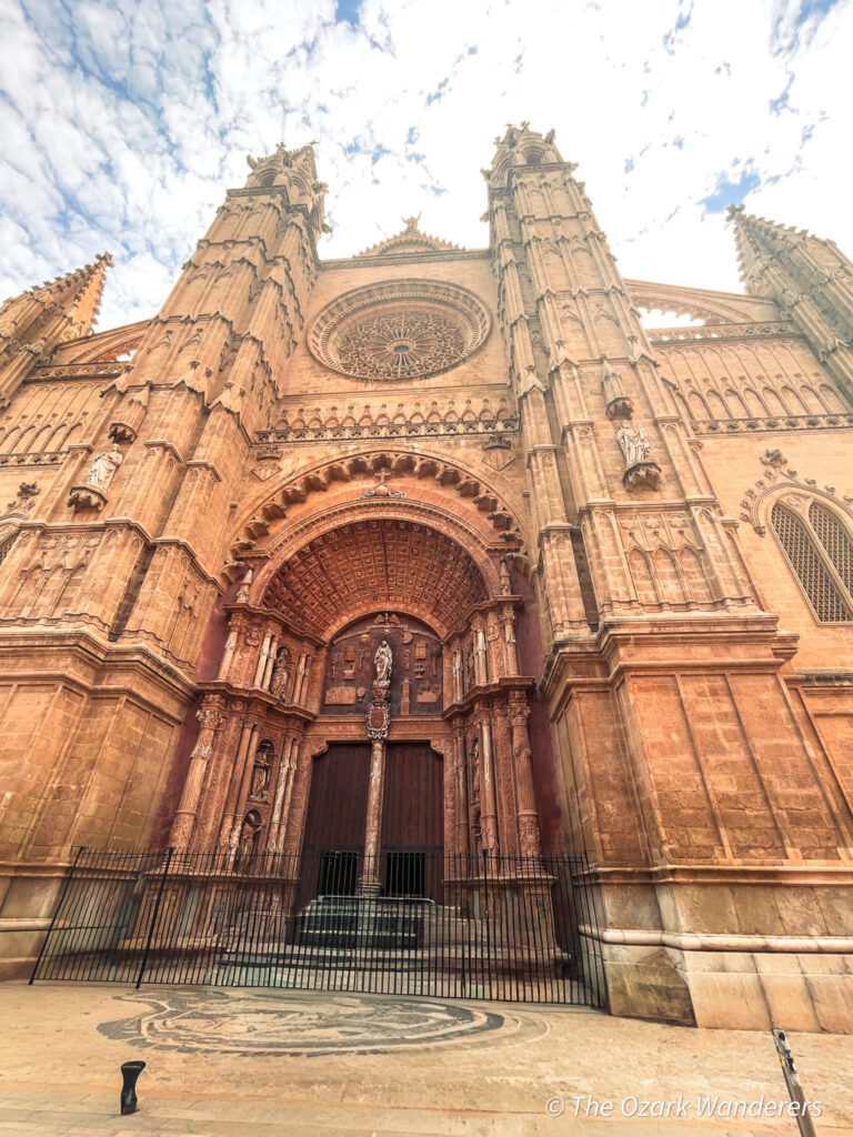 La Seu Cathedral in Palma de Mallorca, Spain — full exterior view of the Gothic façade and rose window, built on the site of a former mosque.